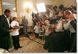 White House Executive Chef Cristeta Comerford discusses the evening's menu with the press in the State Dining Room Thursday, June 29, 2006. The entrée for the dinner is Texas Kobe Beef with cracked black pepper, shitake mushroom jus, silver corn pilaf and sesame-coated wild asparagus.  White House photo by Shealah Craighead
