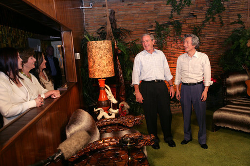 President George W. Bush and Japanese Prime Minister Junichiro Koizumi share a laugh in the Jungle Room while Laura Bush, Priscilla Presley and daughter Lisa-Marie Presley look on, Friday, June 30, 2006, in Memphis, Tennessee, during a tour of Graceland, the home of Elvis Presley. White House photo by Shealah Craighead