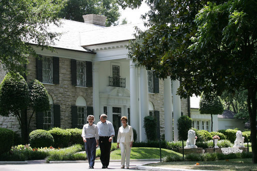 President George W. Bush, Laura Bush and Japanese Prime Minister Junichiro Koizumi, wearing a pair of Elvis-style sunglasses, tour the grounds of Graceland, the home of Elvis Presley, Friday, June 30, 2006, in Memphis. White House photo by Shealah Craighead
