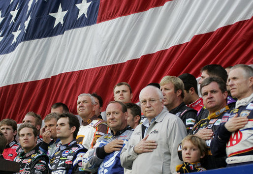 Vice President Dick Cheney joins NASCAR drivers during the playing of the National Anthem Saturday, July 1, 2006, prior to the start of the 2006 Pepsi 400 NASCAR race at Daytona International Speedway in Daytona, Fla. White House photo by David Bohrer