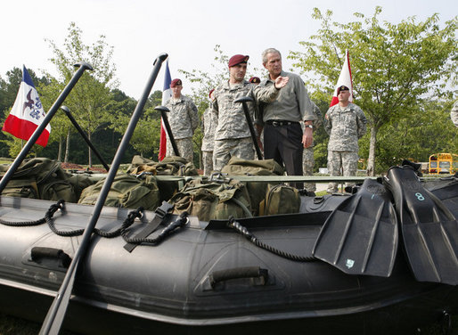 President George W. Bush is shown a fully-equipped combat raiding craft Tuesday, July 4, 2006, during his Independence Day visit to Fort Bragg in North Carolina, where he addressed troops and met with the U.S. Army Special Operations Command. White House photo by Paul Morse