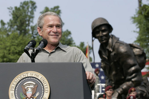 President George W. Bush reacts to applause during his remarks to U.S. troops and their family members Tuesday, July 4, 2006, during an Independence Day celebration at Fort Bragg in North Carolina. President Bush thanked the troops and their families for their service to the nation. White House photo by Paul Morse