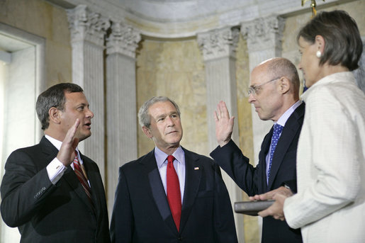 President George W. Bush attends the swearing in of Henry Paulson as the Secretary of Treasury by Supreme Chief Justice John Roberts at the Department of the Treasury Monday, July 10, 2006. White House photo by Eric Draper