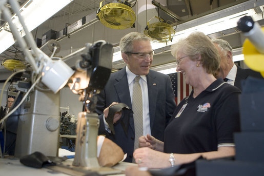 President George W. Bush visits with an employee during a tour of the Allen-Edmonds Shoe Corporation in Port Washington, Wis., Tuesday, July 11, 2006. White House photo by Kimberlee Hewitt