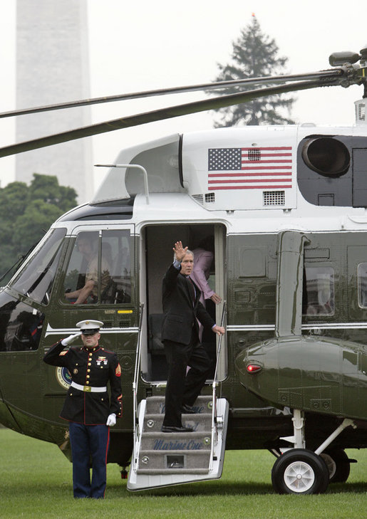  President George W. Bush and Laura Bush board Marine One en route to Germany and Russia on the South Lawn Wednesday, July 12, 2006. President Bush will meet with Chancellor Angela Merkel in Germany and attend the G8 Summit in St. Petersburg, Russia. White House photo by Kimberlee Hewitt