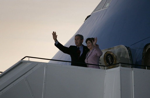 President George W. Bush and Mrs. Laura Bush wave upon arrival of Air Force One to Rostock-Laage Airport in Rostock, Germany. The couple is visiting with Germany's Chancellor Angela Merkel before proceeding to Russia for the G8 Summit. White House photo by Paul Morse