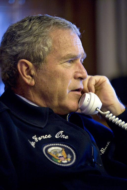 President George W. Bush calls world leaders concerning the situation in the Middle East from his Air Force One office en route to the G8 Summit in St. Petersburg, Russia, Friday, July 14, 2006. White House photo by Eric Draper