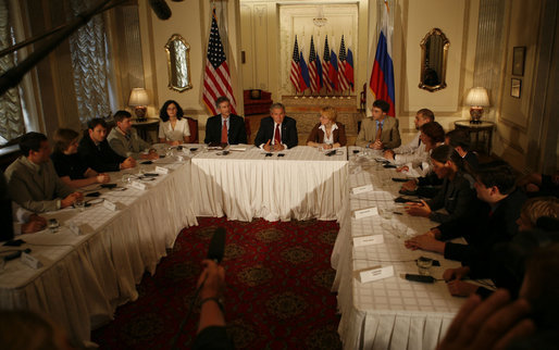 Participants join President George W. Bush Friday, July 14, 2006, at the Consul General's Residence in St. Petersburg, Russia, for a roundtable with the Civil Society organization. White House photo by Paul Morse