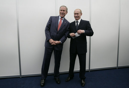 President George W. Bush and President Vladimir Putin of Russia, pose briefly for photographers before their joint press availability Saturday, July 15, 2006, during the G8 Summit in Strelna, Russia. White House photo by Eric Draper