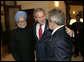 President George W. Bush embraces Indias Prime Minister Dr. Manmohan Singh, left, and Brazilian President Luiz Inacio Lula da Silva, right, at the Konstantinovsky Palace Complex Monday, July 17, 2006. President Bush met with the two leaders separately in bilateral meetings during the G8 Summit in Strelna, Russia.  White House photo by Eric Draper