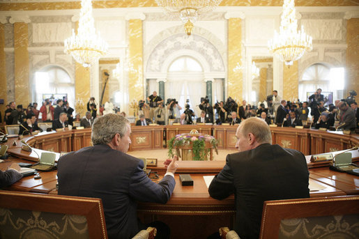 President George W. Bush sits next to Russian President Vladimir Putin during a working session at the G8 Summit at the Konstantinovsky Palace Complex in Strelna, Russia, July 17, 2006. White House photo by Eric Draper