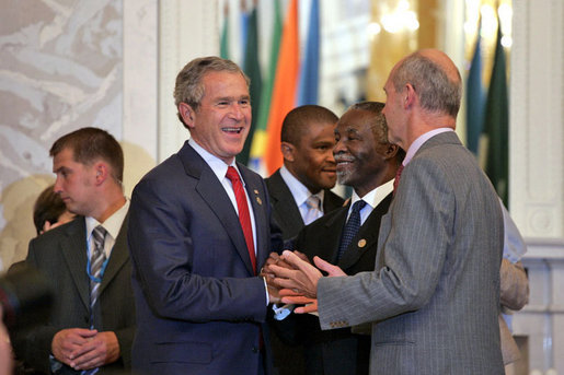 President George W. Bush talks with South African President Thabo Mbeki, center, and World Trade Organization Chief Pascal Lamy during the G8 Summit at Konstantinvosky Palace in Strelna, Russia, Monday, July 17, 2006. White House photo by Paul Morse