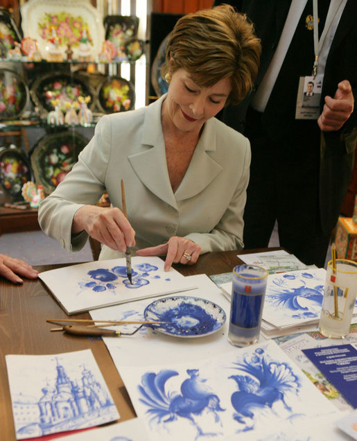 Mrs. Laura Bush participates in an arts and crafts demonstration Monday, July 17, 2006, during an exhibit at the Baltic Star Hotel on the grounds of the Konstantinovsky Palace Complex in Strelna, Russia, site of the G8 Summit that ended Monday. White House photo by Shealah Craighead