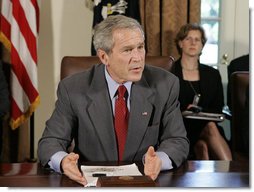 President George W. Bush answers a reporter's question Tuesday, July 18. 2006, in the Cabinet Room at the White House, about ongoing events in the Middle East, during President Bush's meeting with bipartisan members of Congress about his trip to the G8 Summit. White House photo by Kimberlee Hewitt