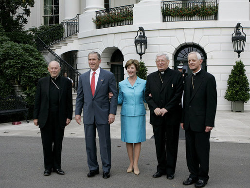 President George W. Bush and Laura Bush welcome outgoing Archbishop of Washington Theodore Cardinal McCarrick, left, the incoming Archbishop of Washington Donald W. Wuerl, right, and Papal Nuncio Pietro Sambi to the White House Tuesday evening, July 18, 2006, for a dinner in their honor. White House photo by Kimberlee Hewitt