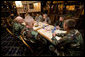President George W. Bush meets with U.S.military service personnel who have recently returned from duty in Iraq and Afghanistan to hear about their experiences Friday, July 21, 2006, at Tamale Fiesta Kitchen restaurant in Aurora, Colorado. White House photo by Eric Draper