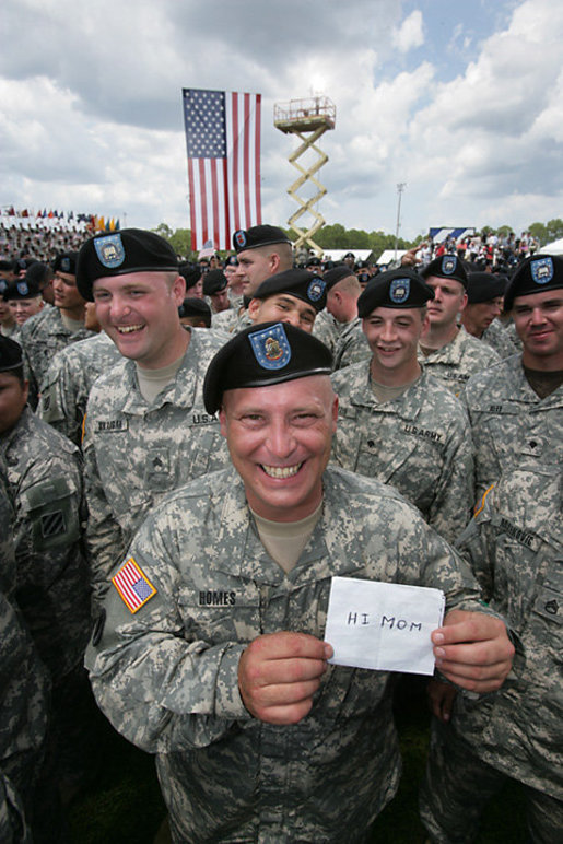 At a rally for the troops attended by Vice President Dick Cheney at Fort Stewart, Ga., a soldier from the Army’s 3rd Infantry Division holds up a message to mom for photographers, Friday, July 21, 2006. White House photo by David Bohrer