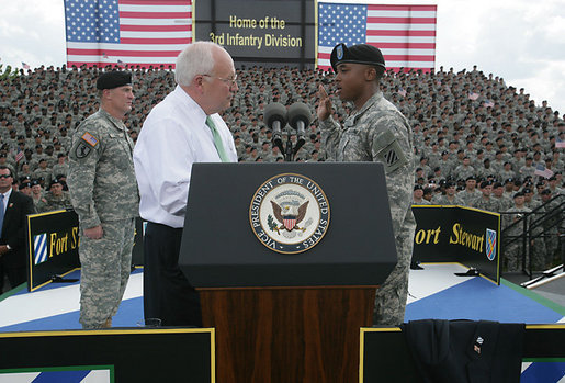 Vice President Dick Cheney administers the Ceremonial Oath of Re-enlistment of Corporal Jarrod Fields, at a rally for the troops at Fort Stewart, Ga., Friday, July 21, 2006. Cpl. Fields was wounded by an improvised explosive device in 2005 while serving in Iraq with the 3rd Infantry Division. White House photo by David Bohrer
