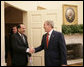 President George W. Bush welcomes Iraqi Prime Minister Nouri al-Maliki into the Oval Office of the White House Tuesday, July 25, 2006, where the two leaders talked about plans to expand the security presence in the neighborhoods of the Iraqi capital. White House photo by Eric Draper