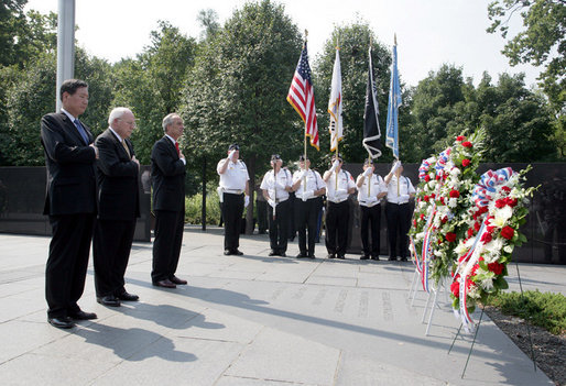 Vice President Dick Cheney stands with Secretary of the Interior Dirk Kempthorne, right, and South Korean Ambassador to the U.S. Tae Sik Lee, left, during a moment of silence after placing a wreath at the Korean War Memorial in Washington, D.C. to commemorate Korean War Veterans Armistice Day, Thursday, July 27, 2006. Today marks the 53rd anniversary of the end of the Korean War. White House photo by David Bohrer