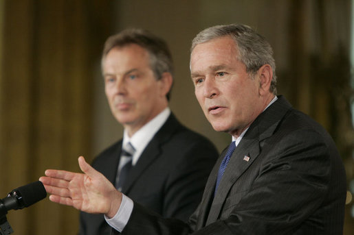 President George W. Bush gestures as he answers a reporter’s question during a joint press availability with Prime Minister Tony Blair of the United Kingdom Friday, July 28, 2006, in the East Room of the White House. White House photo by Paul Morse