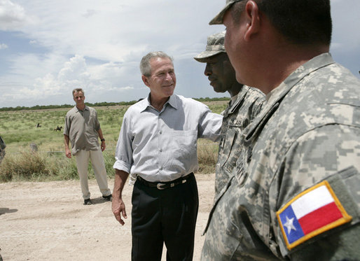 President George W. Bush speaks with members of the National Guard on duty along the U.S.-Mexico border during his visit Thursday, Aug. 3, 2006, in the Rio Grande Valley border patrol sector in Mission, Texas. White House photo by Eric Draper