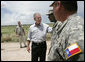 President George W. Bush speaks with members of the National Guard on duty along the U.S.-Mexico border during his visit Thursday, Aug. 3, 2006, in the Rio Grande Valley border patrol sector in Mission, Texas. White House photo by Eric Draper