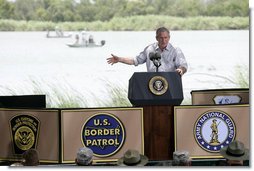 President George W. Bush delivers his remarks on immigration reform from a stage along the Rio Grande River on the U.S.-Mexico border Thursday, Aug. 3, 2006, at the Anzalduas County Park and Dam in Mission, Texas.  White House photo by Eric Draper