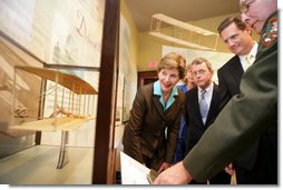 Mrs. Laura Bush, U.S.Senator. Mike DeWine, and U.S.Rep. Mike Turner listen to National Park Ranger Larry Blake as he shows them a model of the Wright Brothers airplane during a tour of the Dayton Aviation Heritage National Historical Park in the Wright-Dunbar Village, a Preserve America neighborhood, in Dayton, Ohio, Wednesday, August 16, 2006. Also shown is Fran DeWine, wife of Sen. Mike DeWine. White House photo by Shealah Craighead