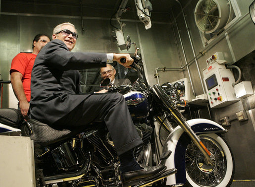 President George W. Bush sits on a motorcycle at the roll test section of the assembly line at the Harley-Davidson Vehicle Operations facility Wednesday, Aug. 16, 2006 in York, Pa., where President Bush also participated in a roundtable discussion on the economy. White House photo by Kimberlee Hewitt