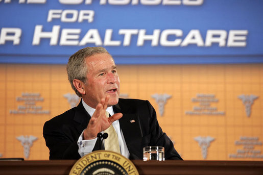 President George W. Bush participates in a panel discussion Tuesday, Aug. 22, 2006, at the Minneapolis Marriott Southwest in Minnetonka, Minn., to offer perspectives on efforts to enhance health care transparency and move towards a value-based health care competition. White House photo by Paul Morse