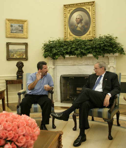 President George W. Bush shares a moment with Rockey Vaccarella Wednesday, Aug. 23, 2006, in the Oval Office of the White House. The St. Bernard Parish resident who drove from Louisiana to meet with the President said "I wanted to thank President Bush for the millions of FEMA trailers that were brought down there." He added, ". I just don't want the government and President Bush to forget about us." White House photo by Paul Morse