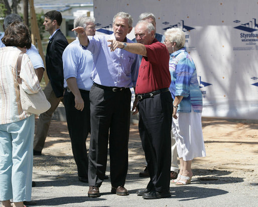 President George W. Bush is joined by Biloxi, Miss. Mayor A.J. Holloway, right, Monday, Aug. 28, 2006, during President Bush’s walking tour in the same Biloxi neighborhood he visited following Hurricane Katrina in September 2005. The tour allowed President Bush the opportunity to assess the progress of the area’s recovery and rebuilding efforts following the devastating hurricane. White House photo by Eric Draper