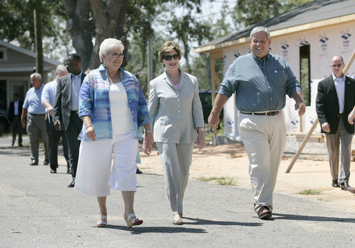 Mrs. Laura Bush meets with Biloxi, Miss., residents Sandy Patterson, left, and her husband, Thomas “Lynn” Patterson Monday, Aug. 28, 2006, during a walking tour in the same Biloxi neighborhood President George W. Bush visited following Hurricane Katrina in September 2005. The tour allowed President Bush the opportunity to assess the progress of the area’s recovery and rebuilding efforts a year after the devastating hurricane. White House photo by Eric Draper