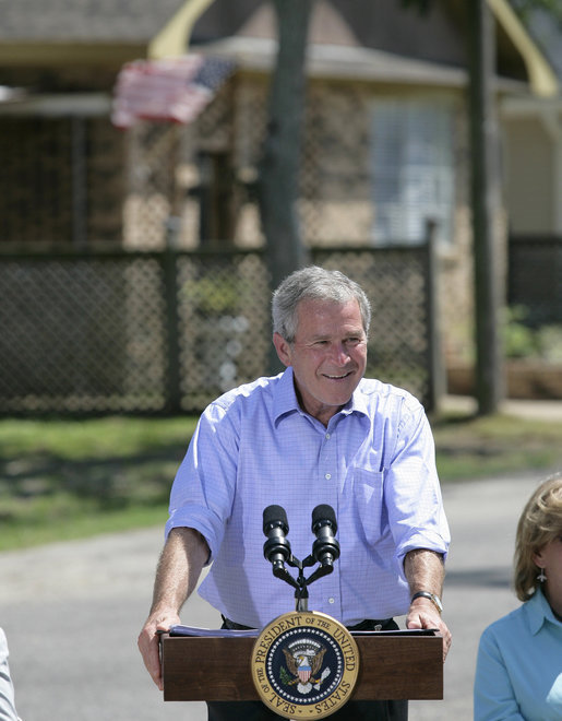 President George W. Bush smiles as he addresses his remarks to residents and state community leaders Monday, Aug. 28, 2006, following his walking tour through the Biloxi, Miss., neighborhood he visited following Hurricane Katrina in September 2005. The tour allowed President Bush the opportunity to assess the progress of the area’s recovery and rebuilding efforts a year after the devastating hurricane. White House photo by Eric Draper
