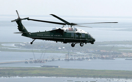 U.S. Marine One carrying President George W. Bush flies above a bridge construction project Monday, Aug. 28, 2006, on a flight from Mississippi to Louisiana, where President Bush is on a two-day visit to the Gulf Region to assess the region’s recovery and rebuilding efforts a year after the devastation of Hurricane Katrina. White House photo by Eric Draper