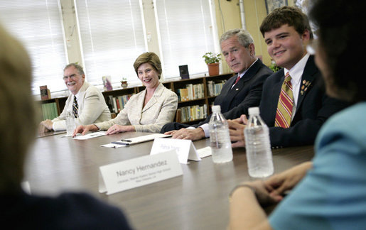 President George W. Bush and Laura Bush participate at a roundtable discussion Tuesday, Aug. 29, 2006, at Warren Easton Senior High School in New Orleans on the importance of rebuilding schools and school libraries, as the Gulf Coast marked the one- year anniversary of Hurricane Katrina. Mrs. Bush, speaking about the Laura Bush Foundation for America’s Libraries Gulf Coast School Library Recovery Initiative, congratulated the ten schools represented at the table on being awarded the first-round grants to help rebuild their schools. White House photo by Eric Draper