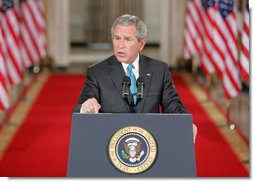 President George W. Bush emphasizes a point Wednesday Sept. 6, 2006 in the East Room of the White House, as he discusses the administration's draft legislation to create a strong and effective military commission to try suspected terrorists. The bill being sent to Congress, said President Bush, "reflects the reality that we are a nation at war, and that it is essential for us to use all reliable evidence to bring these people to justice." White House photo by Kimberlee Hewitt