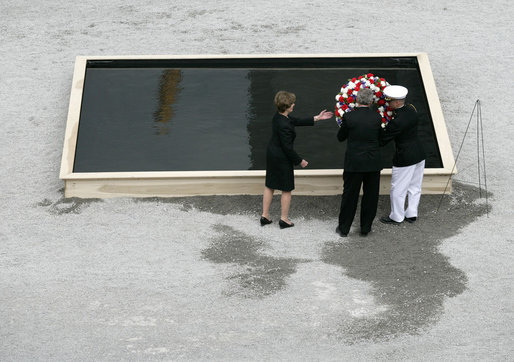 To commemorate the fifth anniversary of the terrorist attacks on September 11, 2001, President George W. Bush and Laura Bush lay a wreath in the south tower reflecting pool at the World Trade Center site in New York City Sunday, September 10, 2006. White House photo by Eric Draper