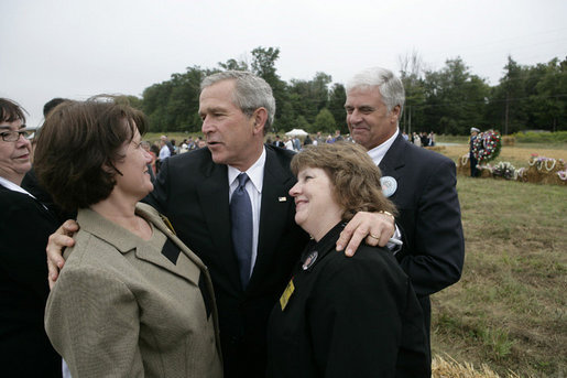 President George W. Bush embraces family members of those killed aboard United Flight 93 during the ceremony Monday, Sept. 11, 2006 in Shanksville, Pa., commemorating the fifth anniversary of the attacks on Sept. 11, 2001. White House photo by Eric Draper