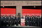 President George W. Bush and Laura Bush stand with New York City First Responders at the Fort Pitt Firehouse for a moment of silence Monday, September 11, 2006, in New York City to commemorate the fifth anniversary of the September 11th terrorist attacks. Also pictured is a door from Ladder 18, which was destroyed in the collapse of the World Trade Center. White House photo by Kimberlee Hewitt