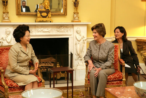 Mrs. Laura Bush talks with Mrs. Kwon Yang-Sook, wife of the President of South Korea, Thursday, September 14, 2006, during a coffee hosted by Mrs. Bush at the White House. White House photo by Shealah Craighead