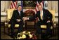 President George W. Bush exchanges handshakes with El Salvador's President Elias Antonio Saca at the start of their bilateral meeting Monday, Sept. 18, 2006, at New York's Waldorf-Astoria Hotel. White House photo by Eric Draper