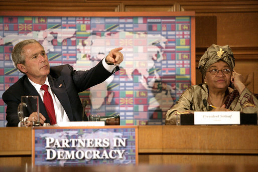 President George W. Bush sits next to Liberia's President Ellen Johnson-Sirleaf during a roundtable discussion on democracy Tuesday, Sept. 19, 2006, during the President's visit to New York City for the 61st United Nations General Assembly. White House photo by Eric Draper