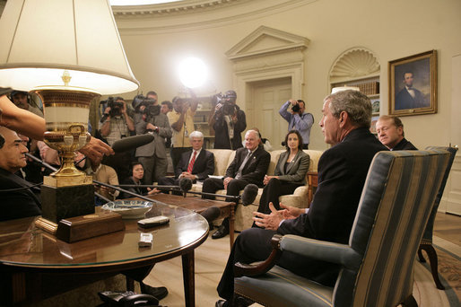 President George W. Bush addresses the media during a meeting with business leaders on Lebanon Private Sector Initiative in the Oval Office Monday, Sept. 25, 2006. Seated next to President Bush is CEO John Chambers of Cisco Systems. Participants also include Chairman Craig Barrett of Intel Corp., CEO Ray Irani of Occidental Petroleum Corp., and Chairman Yousif Ghafari of Ghafari, Inc. "Our goal, and our mission, is to help Lebanese citizens and Lebanese businesses not only recover, but to flourish, because we believe strongly in the concept of a democracy in Lebanon," said President Bush. White House photo by Eric Draper