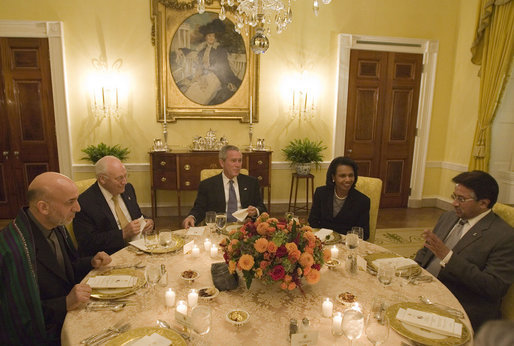 President George W. Bush sits with Vice President Dick Cheney and Secretary of State Condoleezza Rice as they host a working dinner Wednesday, Sept. 27, 2006, at the White House with President Hamid Karzai, left, of the Islamic Republic of Afghanistan, and President Pervez Musharraf, of the Islamic Republic of Pakistan. White House photo by Eric Draper