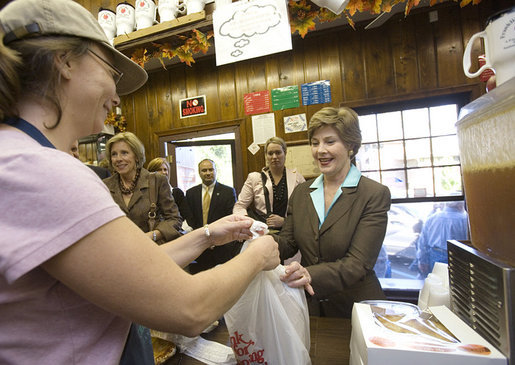 Mrs. Laura Bush makes a purchase at Franklin Cider Mill in Franklin, Mich., Thursday, Sept. 28, 2006. The mill dates back to 1837, the year Michigan was admitted to the Union. White House photo by Shealah Craighead