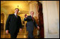 President George W. Bush and Senate Majority Leader Bill Frist, R-Tenn., walk past the press as they arrive for the Republican Senate Conference at the U. S. Capitol Thursday, Sept. 28, 2006. White House photo by Eric Draper