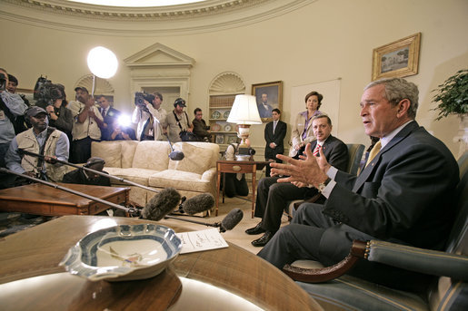 President George W. Bush and Prime Minister Recep Tayyip Erdogan of Turkey talk to the press in the Oval Office Monday, October 2, 2006. "We had an important discussion about both Iraq and Iran. Our desire is for -- to help people who care about a peaceful future to reject radicalism and extremism," said President Bush. White House photo by Eric Draper