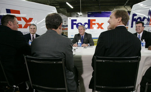 President George W. Bush meets with business leaders Friday, Oct. 6, 2006, at the FedEx Express DCA Facility in Washington, D.C., during a roundtable discussion on job growth and the economy. President Bush was joined at the meeting by U.S. Secretary of the Treasury Henry Paulson and Al Hubbard, Assistant to the President for Economic Policy. White House photo by Kimberlee Hewitt